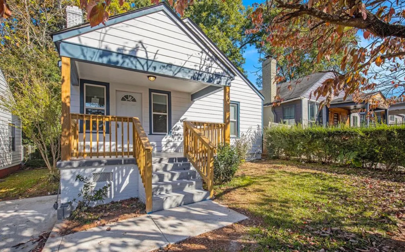 Completed exterior renovation with new porch and deck
