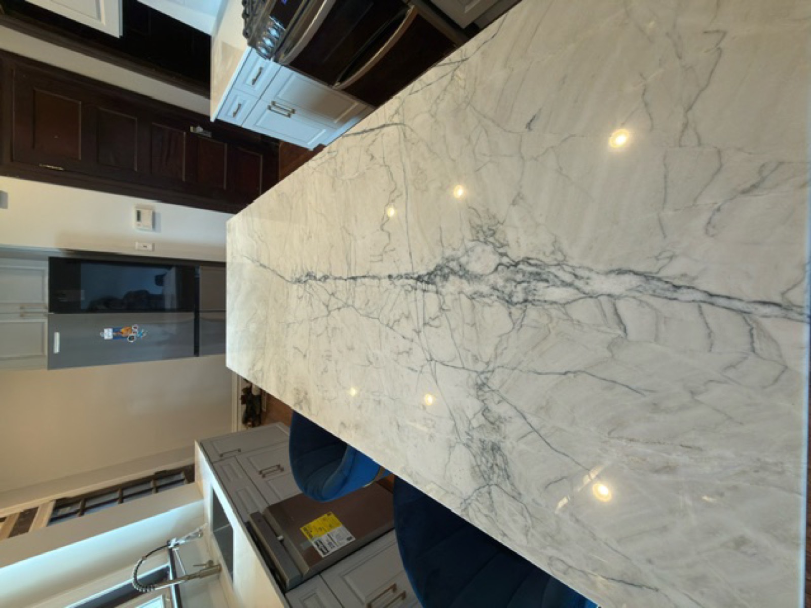 Marble waterfall island countertop — kitchen renovation